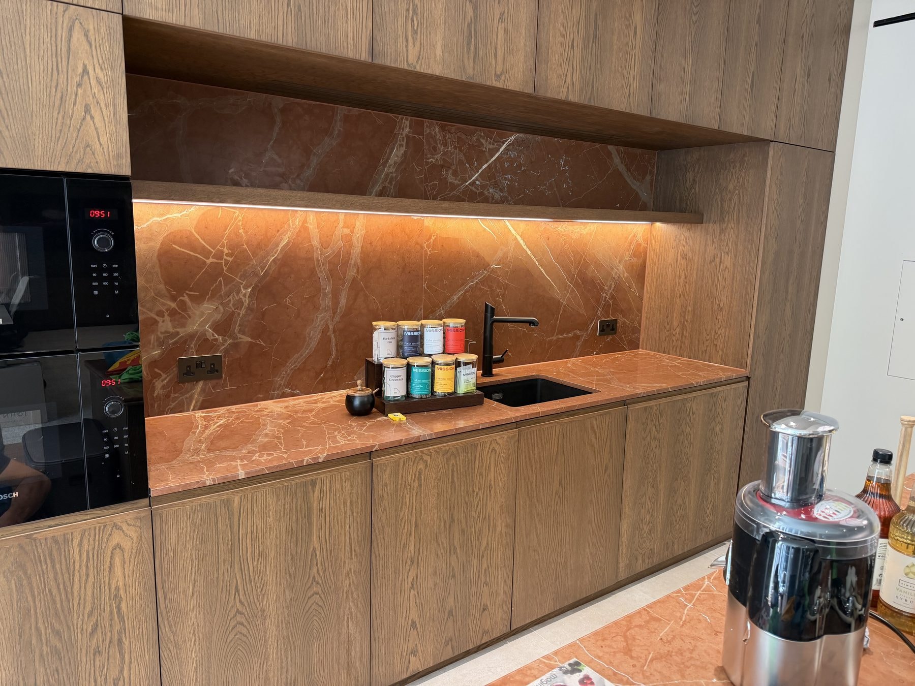 Kitchenette & Island Bar in Rosso Calamandina — Rosso Calamandina, honed