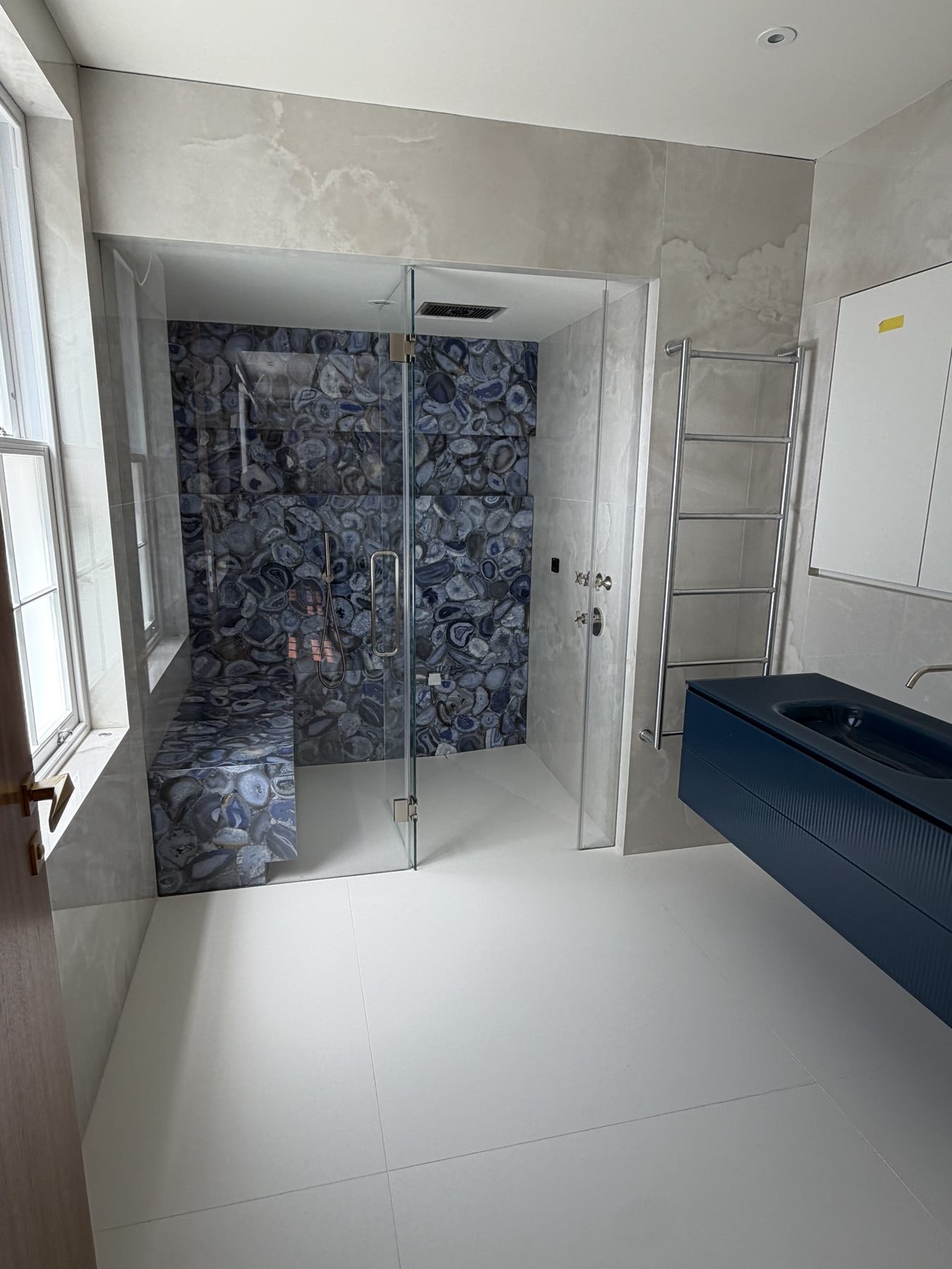Shower in Xtone Agate Blue — Xtone Agate Blue shower walls, Dekton Helena walls, Dekton Zenith floor